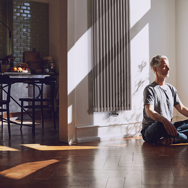man meditates, old building flat, relaxed, charleston