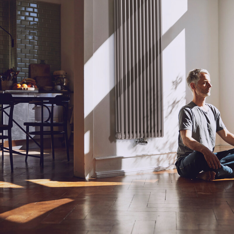 man meditates, old building flat, relaxed, charleston