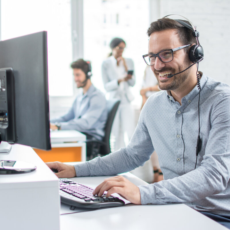 Guy in call, on pc, smiling, phone call, meeting, office,