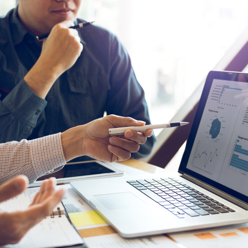Two businessmen, analyzing, data, graph, laptop, computer screen
